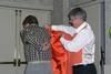 Larry Checkon Receives the Orange Jacket