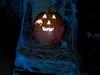 nighttime glowing pumpkin with light in it